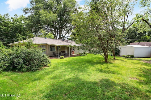 530 Oakhurst Dr, Hernando, MS 38632 - view of grassy yard with an outdoor structure and a patio