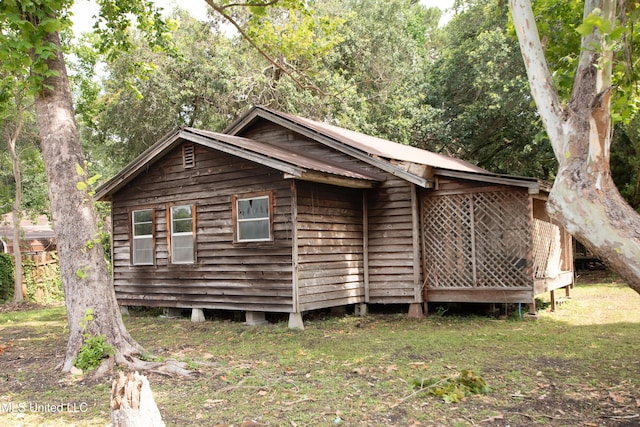 5619 Grierson St, Moss Point, MS 39563 - view of side of property with a metal roof