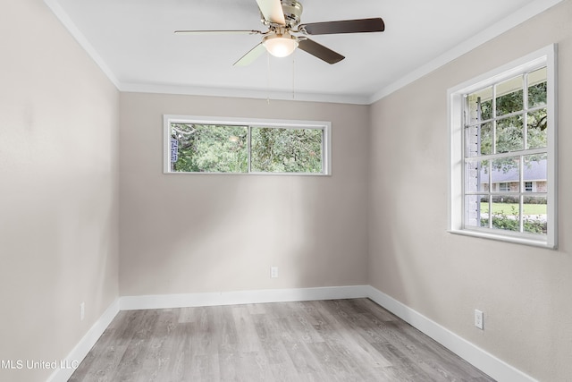 unfurnished room featuring crown molding, light hardwood / wood-style flooring, a healthy amount of sunlight, and ceiling fan