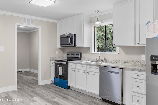 kitchen featuring light hardwood / wood-style floors, white cabinets, stainless steel appliances, and sink