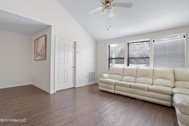 living area with ceiling fan, a textured ceiling, baseboards, wood finished floors, and visible vents