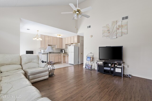 living room with visible vents, wood finished floors, high vaulted ceiling, baseboards, and ceiling fan with notable chandelier