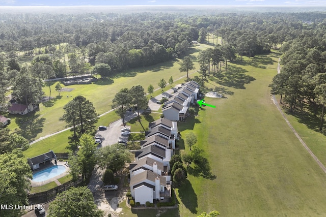 aerial view featuring a wooded view