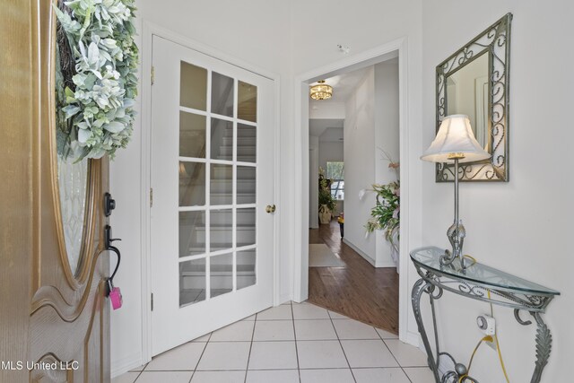 entryway featuring light tile patterned flooring