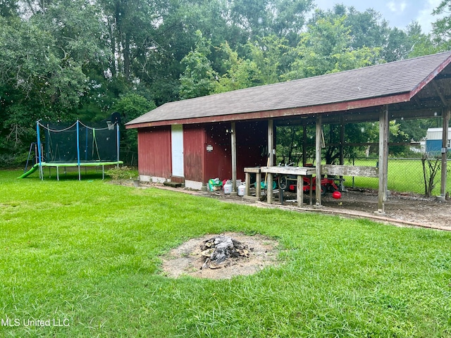 view of yard with a trampoline