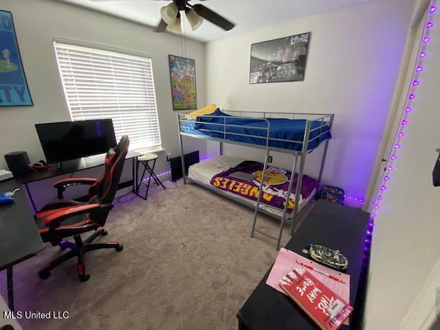 bedroom featuring a ceiling fan and carpet flooring