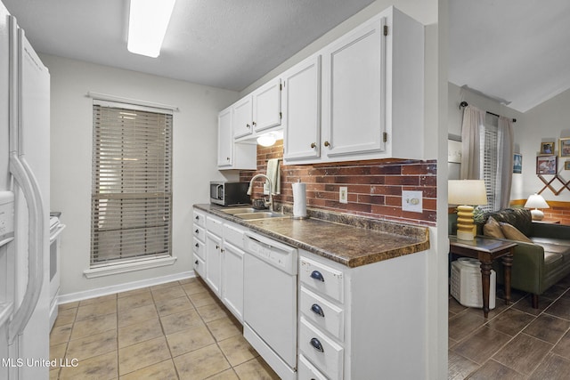 7012 Copper Cv, Ridgeland, MS 39157 - kitchen featuring white appliances, a sink, dark countertops, backsplash, and white cabinets