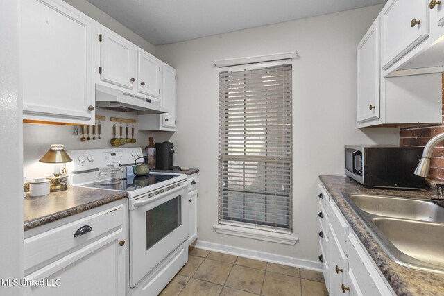 7012 Copper Cv, Ridgeland, MS 39157 - kitchen featuring under cabinet range hood, white electric range oven, a sink, light tile patterned floors, and white cabinets