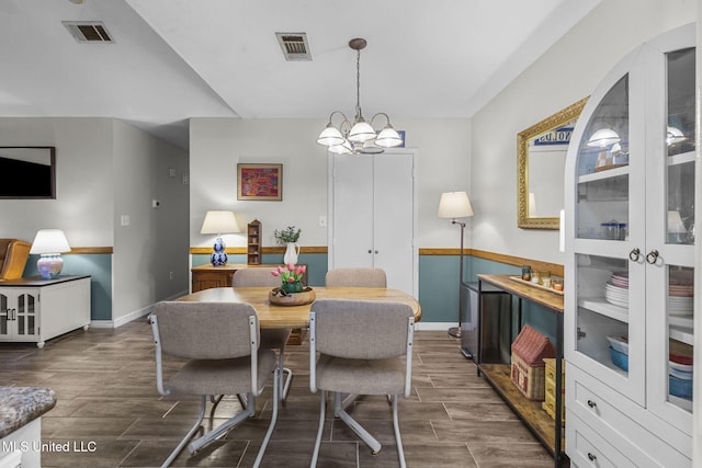 7012 Copper Cv, Ridgeland, MS 39157 - dining space featuring wood finish floors, baseboards, and a chandelier