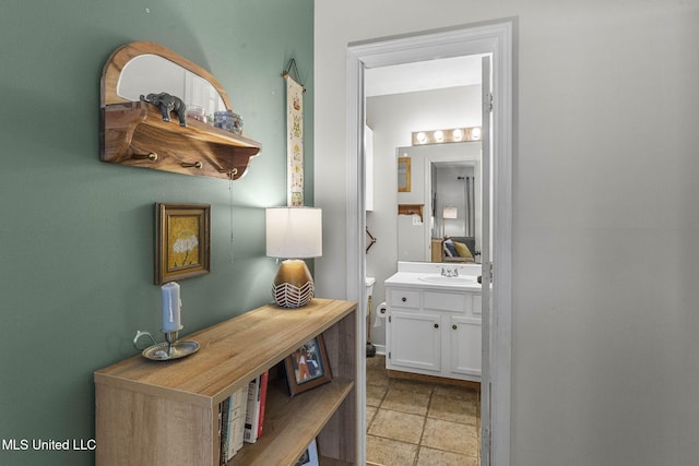 7012 Copper Cv, Ridgeland, MS 39157 - corridor featuring a sink and light stone finish flooring