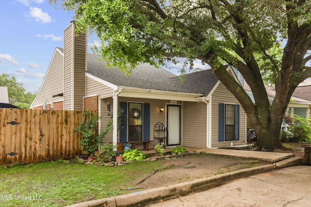 7012 Copper Cv, Ridgeland, MS 39157 - view of front of house with covered porch, roof with shingles, and a chimney
