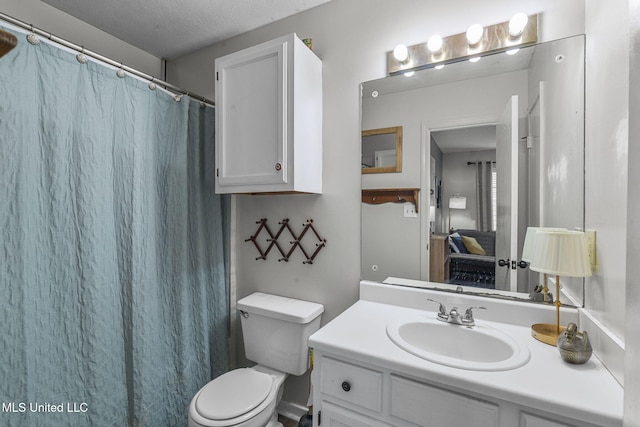 7012 Copper Cv, Ridgeland, MS 39157 - bathroom featuring vanity, toilet, curtained shower, and a textured ceiling