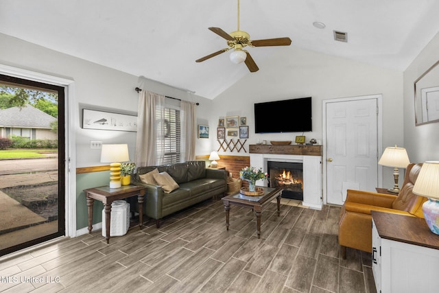 7012 Copper Cv, Ridgeland, MS 39157 - living room featuring lofted ceiling, ceiling fan, wood finished floors, a fireplace with flush hearth, and baseboards
