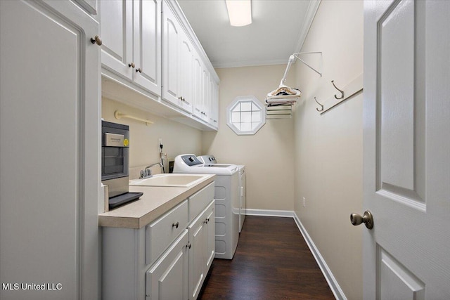 205 Stonebriar Ln, Brandon, MS 39042 - laundry room featuring cabinet space, washer and dryer, dark wood-type flooring, and ornamental molding