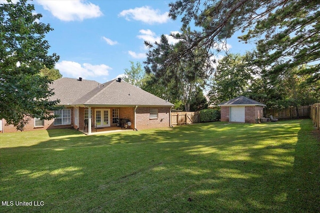 205 Stonebriar Ln, Brandon, MS 39042 - fenced backyard featuring french doors, a patio, and a storage unit