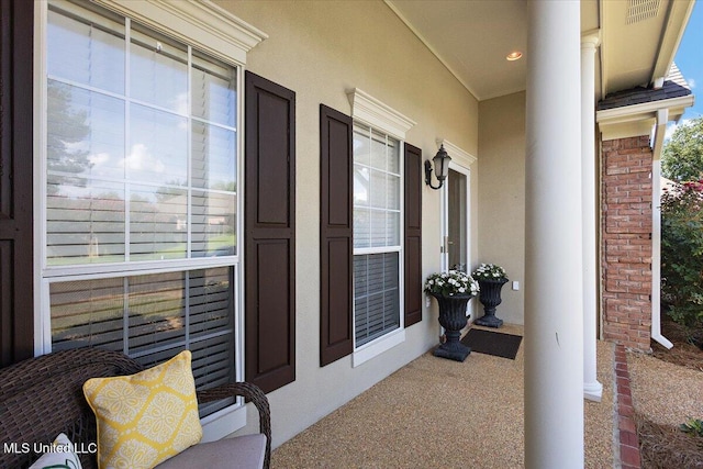 205 Stonebriar Ln, Brandon, MS 39042 - doorway to property featuring stucco siding and covered porch