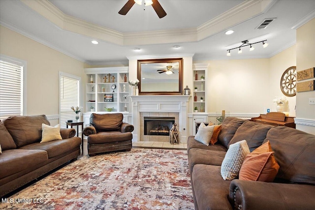 205 Stonebriar Ln, Brandon, MS 39042 - living area featuring a ceiling fan, a fireplace, ornamental molding, built in shelves, and recessed lighting