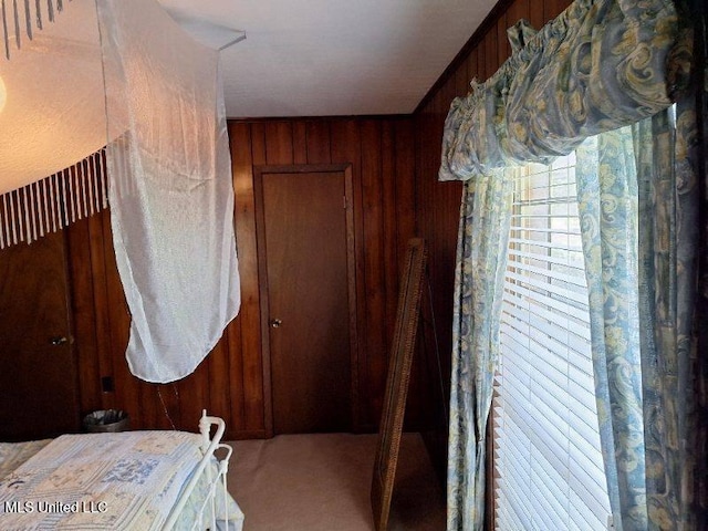 bedroom with wood walls