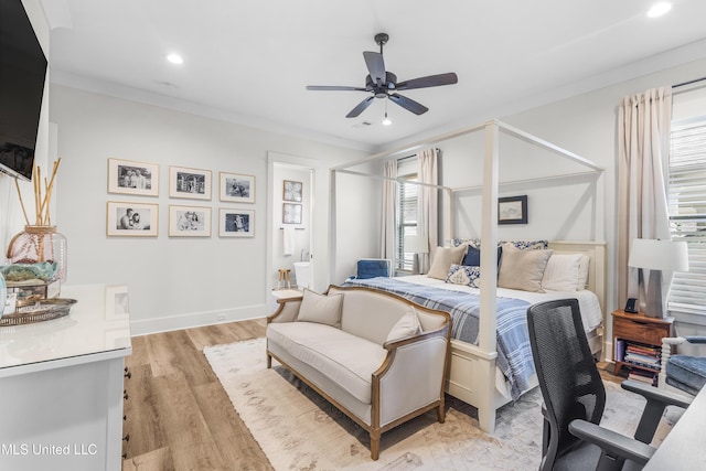 bedroom featuring light wood-type flooring, ceiling fan, and ornamental molding