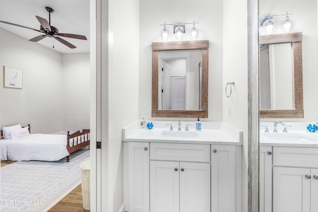 bathroom featuring vanity, hardwood / wood-style flooring, and ceiling fan