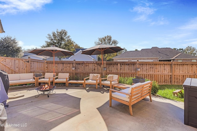 view of patio / terrace featuring an outdoor living space with a fire pit