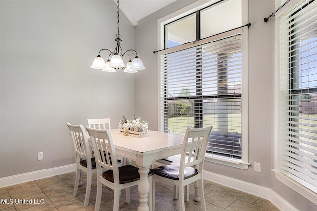 6865 Payne Ln, Olive Branch, MS 38654 - dining space with a chandelier, light tile patterned floors, and vaulted ceiling