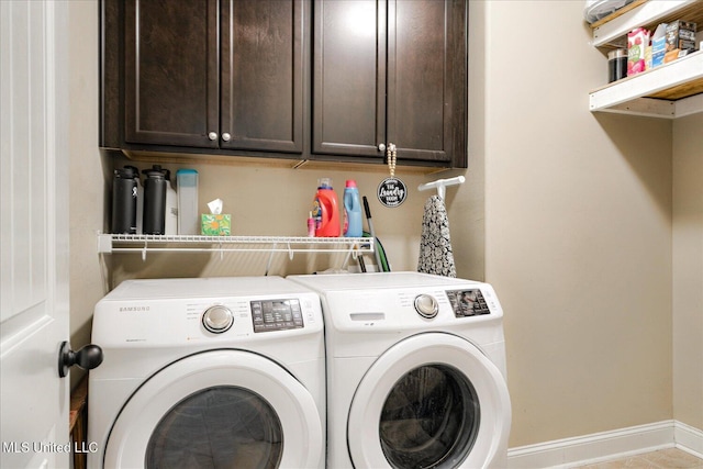 6865 Payne Ln, Olive Branch, MS 38654 - washroom featuring washing machine and dryer and cabinet space