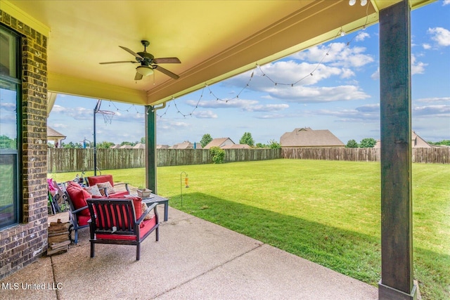 6865 Payne Ln, Olive Branch, MS 38654 - fenced backyard with a patio area and a ceiling fan