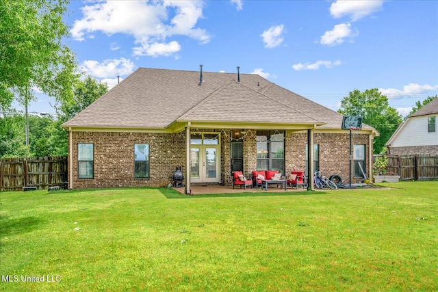 6865 Payne Ln, Olive Branch, MS 38654 - rear view of property with a fenced backyard, brick siding, a patio area, and french doors