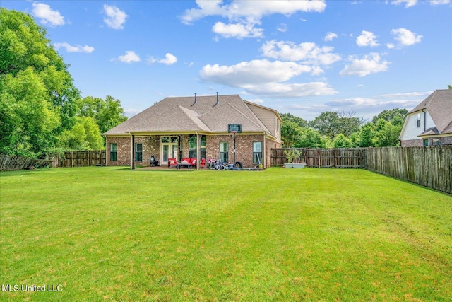 6865 Payne Ln, Olive Branch, MS 38654 - rear view of property featuring brick siding, a fenced backyard, and a patio area