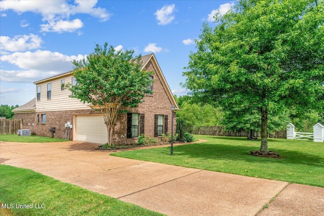 6865 Payne Ln, Olive Branch, MS 38654 - view of front facade featuring brick siding, concrete driveway, and an attached garage