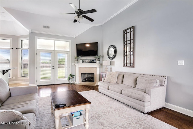 6865 Payne Ln, Olive Branch, MS 38654 - living area with wood finished floors, crown molding, vaulted ceiling, ceiling fan, and a fireplace with flush hearth