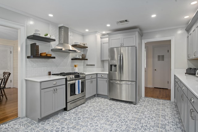 kitchen with gray cabinets, ornamental molding, stainless steel appliances, and range hood