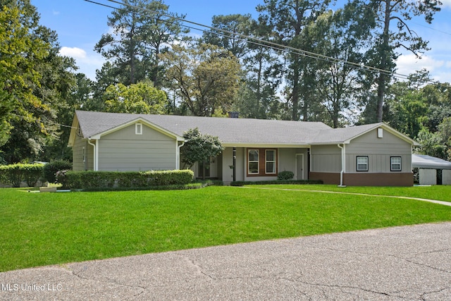 single story home featuring a front yard