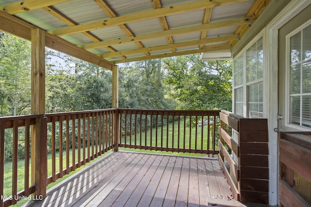 wooden terrace with a yard