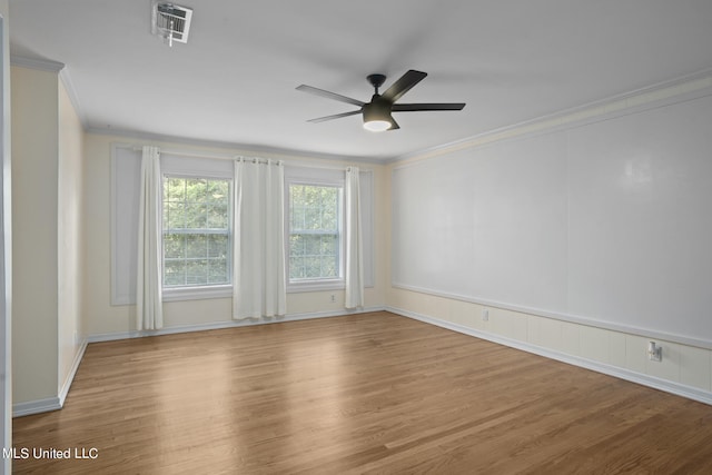 unfurnished room featuring ornamental molding, hardwood / wood-style flooring, and ceiling fan