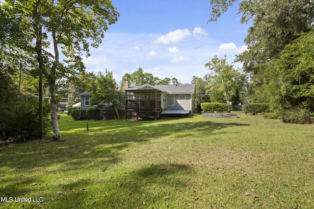 view of yard with a sunroom