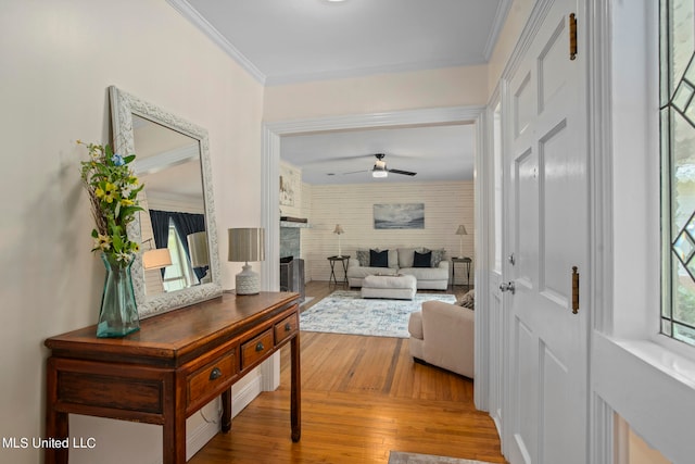 corridor with crown molding and hardwood / wood-style flooring