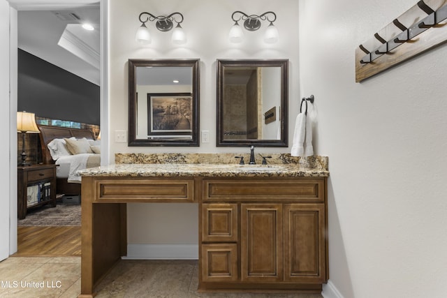14463 Aerie Rd, Gulfport, MS 39503 - bathroom featuring vanity, ensuite bath, and baseboards