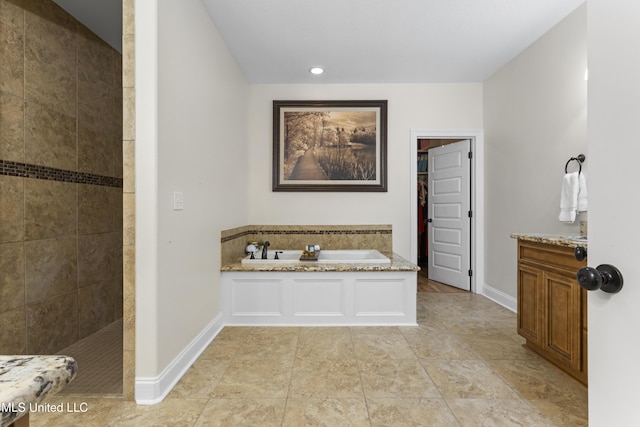 14463 Aerie Rd, Gulfport, MS 39503 - full bathroom with walk in shower, a garden tub, and baseboards
