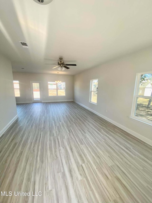 unfurnished living room with ceiling fan and light wood-type flooring