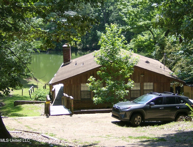 3336 Monans Rill Cv, Hernando, MS 38632 - view of side of property featuring a chimney and a water view