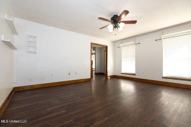 empty room featuring dark hardwood / wood-style floors and ceiling fan