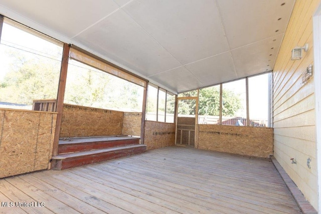 unfurnished sunroom with a wealth of natural light