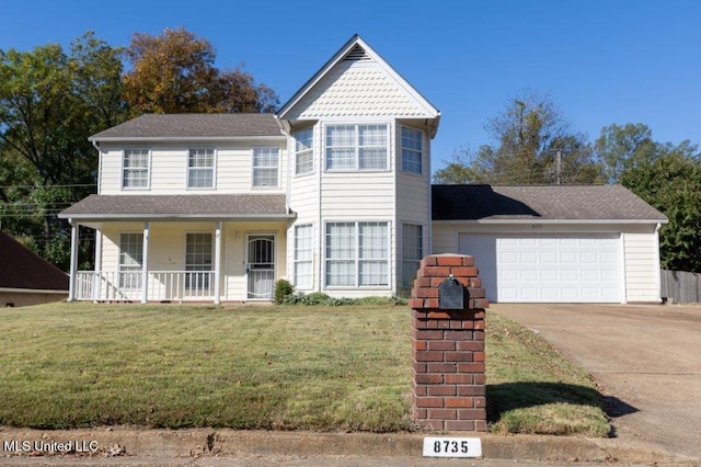 view of front facade featuring a porch, a front yard, and a garage