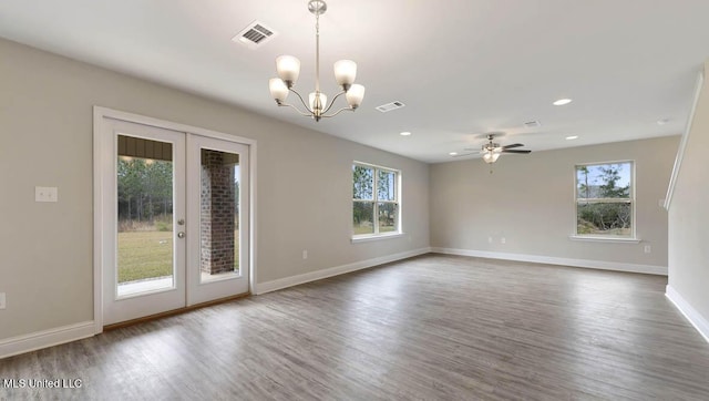 empty room featuring baseboards, visible vents, wood finished floors, french doors, and recessed lighting