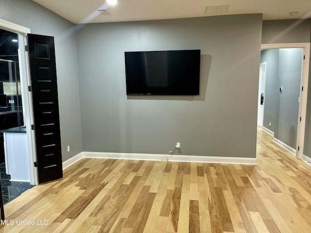 unfurnished living room featuring light wood-type flooring