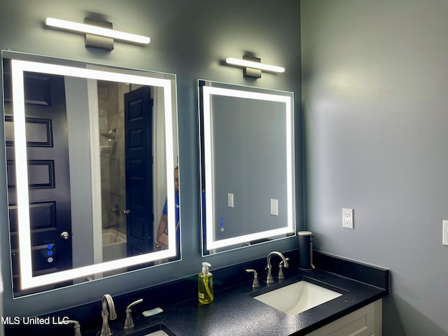 bathroom with vanity and bathtub / shower combination