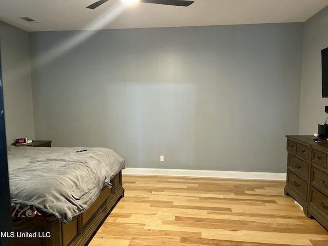 bedroom with ceiling fan and light wood-type flooring