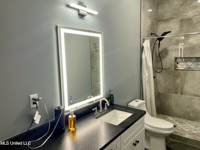 bathroom featuring vanity, toilet, and a shower with shower curtain